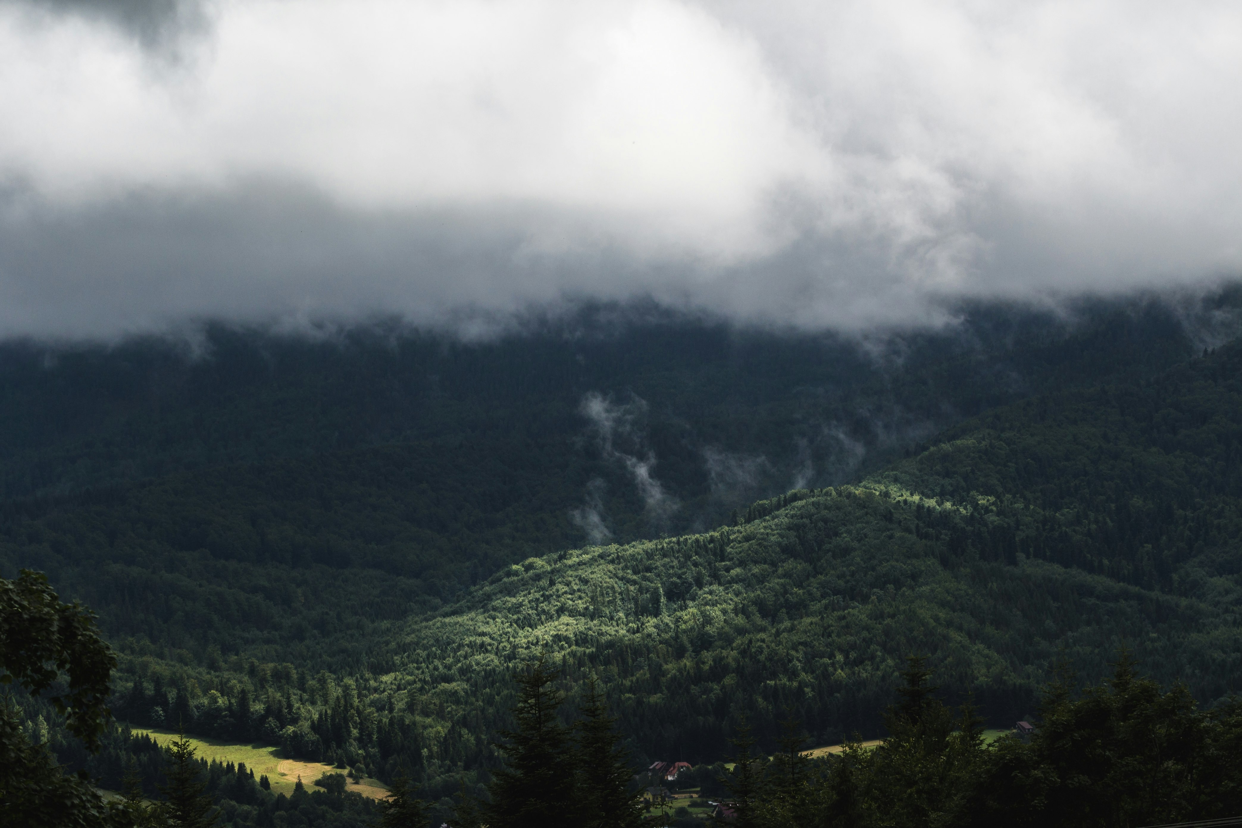 mountain range under stratocumulus clouds